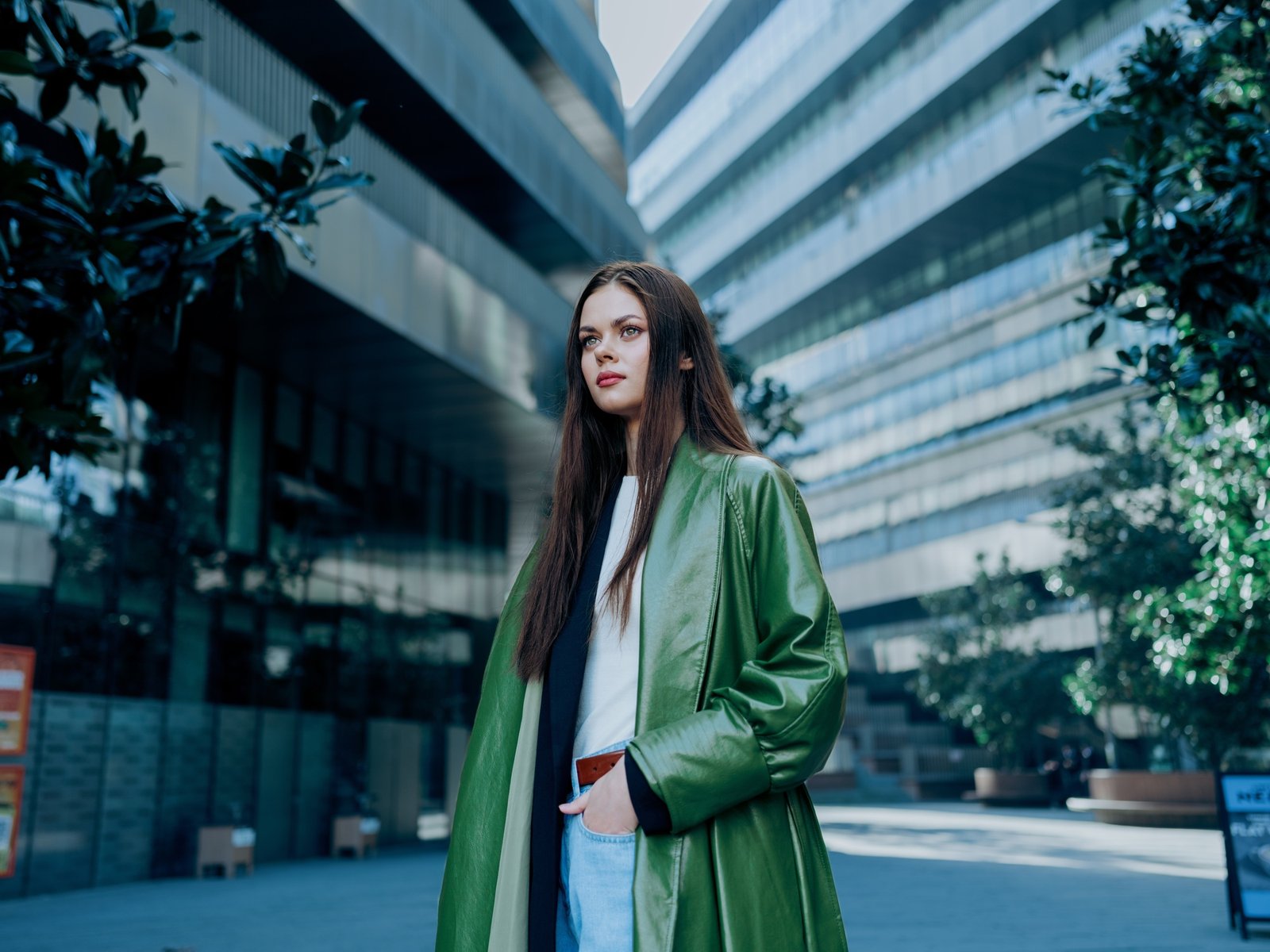 Business woman brunette portrait in the city multistory office buildings, the concept of business